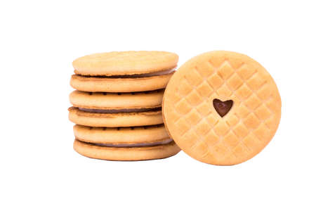 Stack of cookies with cream and one with a heart in the middleの写真素材