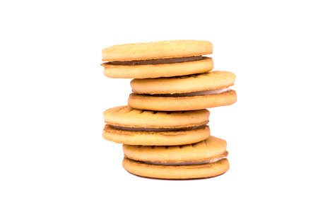 A stack of four cookies with cream on a white backgroundの写真素材