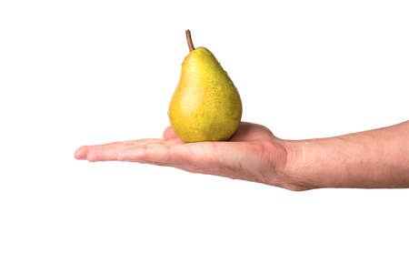 Man in the hand holds a pear in the palm on a white backgroundの写真素材