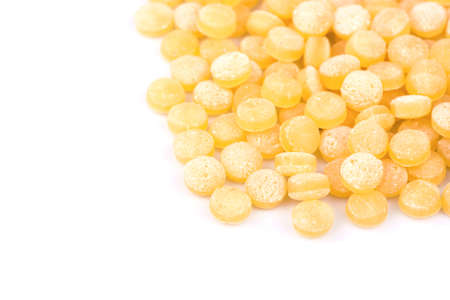 A scattered pile of couscous on a white backgroundの写真素材