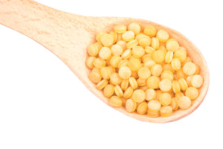 Couscous granules in wooden spoonの写真素材