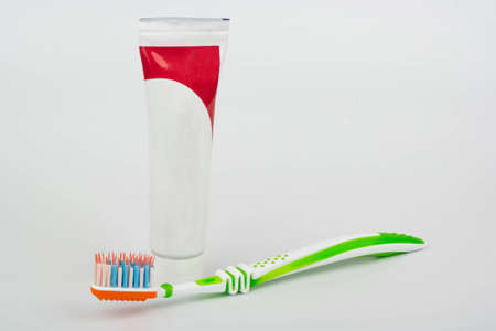 Toothbrush and toothpaste on a white background