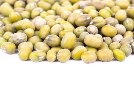 Scattered grains green lentils on a white backgroundの写真素材