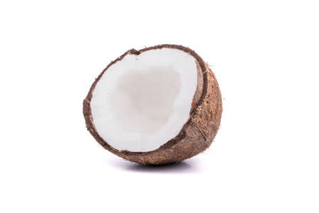 Half of ripe coconut with pulp on a white backgroundの写真素材