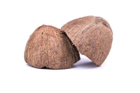 Two halves of a coconut shell fruit on a white background