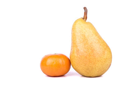 Ripe fruit mandarin and yellow pear on a white backgroundの写真素材