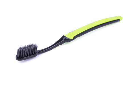 Toothbrush black and green color on a white backgroundの写真素材