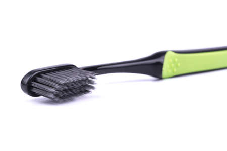 Toothbrush black and green color close-up shotの写真素材