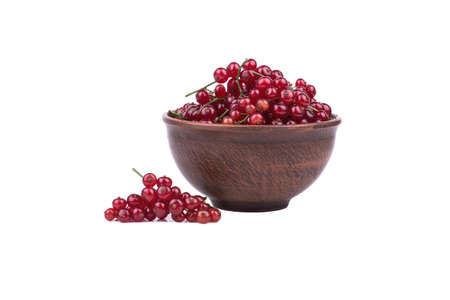 Full bowl of fresh red currants isolated on a white backgroundの写真素材