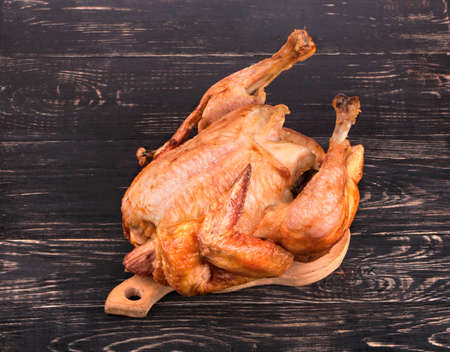 Home fried chicken on a wooden background, top viewの写真素材