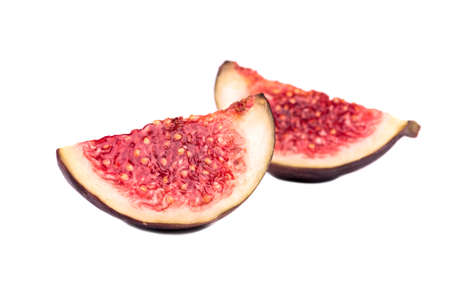 Two slices of fresh figs isolated on white backgroundの写真素材