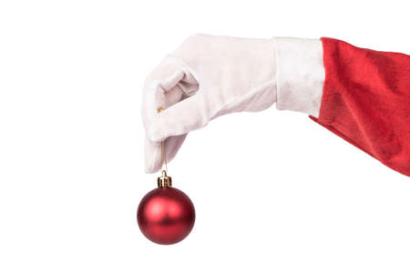 Santa Claus holding a red Christmas ball on a white backgroundの写真素材