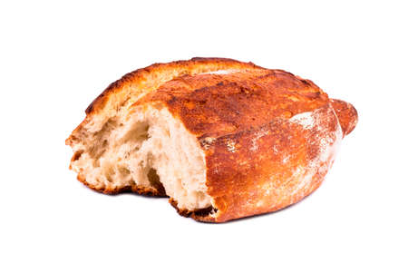 Half of fresh homemade French bread on a white background