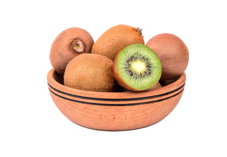 Wooden bowl of fresh and juicy fruit kiwi on a white backgroundの写真素材