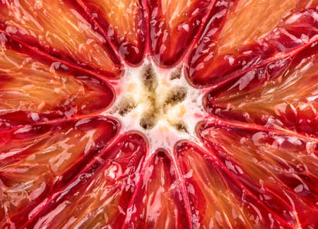 Background of juicy and ripe fruit halves Sicilian Orangeの写真素材