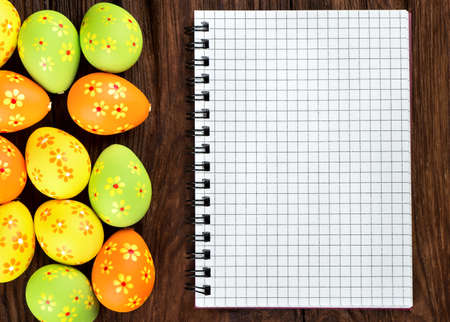 Blank notebook with multi-colored Easter eggs for congratulationsの写真素材