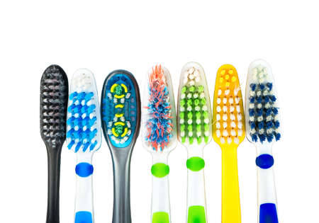Several multi-colored toothbrushes on a white backgroundの写真素材