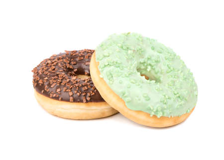 Two donut with chocolate icing and green isolated on white backgroundの写真素材