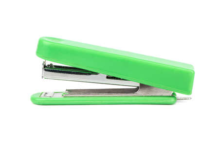 Green office stapler isolated on white backgroundの写真素材