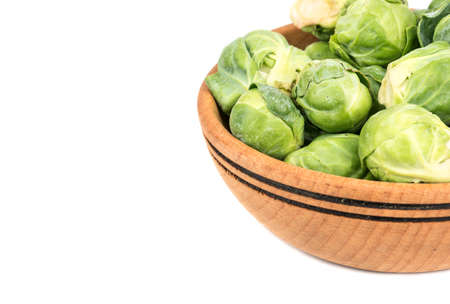 Part of a bowl of fresh brussels sprouts on a white backgroundの写真素材