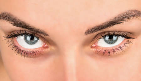 Beautiful blue female eye with makeup closeupの写真素材