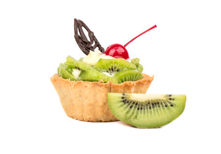 Delicious fruit cake with a slice of kiwi on a white backgroundの写真素材