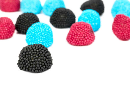 Scattered colored berry jelly candies on a white backgroundの写真素材