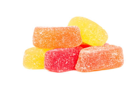 Pile of multi-colored jelly candies on a white backgroundの写真素材