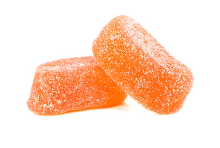 Two orange jelly candies isolated on a white background