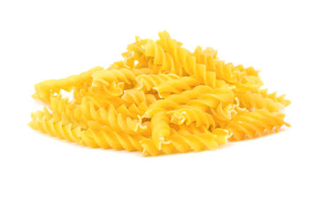 Bunch of raw pasta fusilli on white backgroundの写真素材