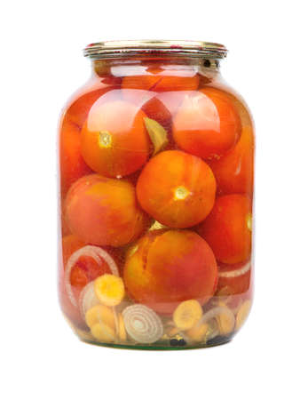Preserved red tomatoes in glass jar on white backgroundの写真素材