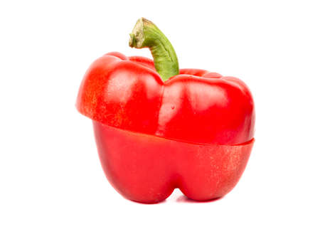 Delicious fresh red pepper cut in half on white backgroundの写真素材