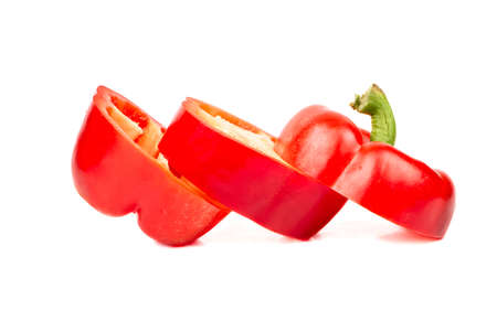 Cut fresh pepper on three slices on white backgroundの写真素材