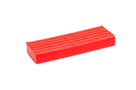 Piece of red plasticine isolated on white backgroundの写真素材
