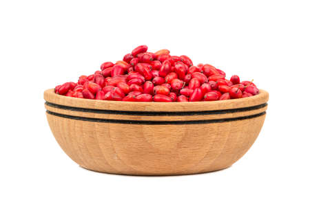 Fresh barberries in wooden bowl isolated on white backgroundの写真素材