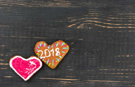Homemade Christmas gingerbread heart on a blank wooden background, top viewの写真素材