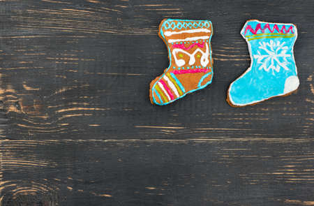 Two home christmas gingerbread sock blank on wooden backgroundの写真素材