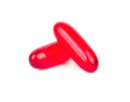 Two red pill capsule isolated on white backgroundの写真素材