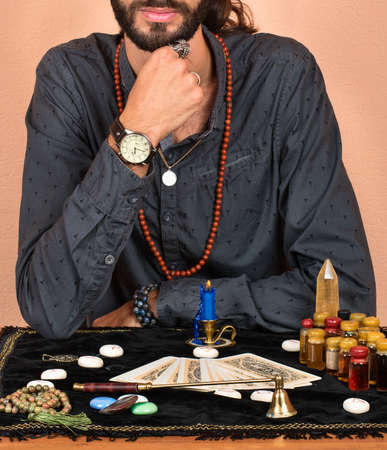 Young mage lay on the table Tarot cardsの写真素材