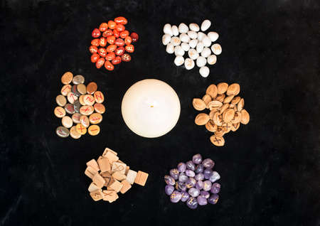 Several piles of magical runes made of different materials, view from aboveの写真素材