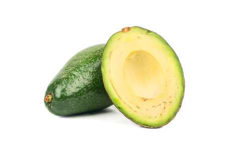 Green avocado with half on white backgroundの写真素材