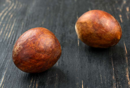 Two seeds fresh avocado on a dark table closeupの写真素材