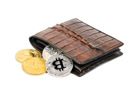 Gold and silver coins to bitcoin wallet on white backgroundの写真素材