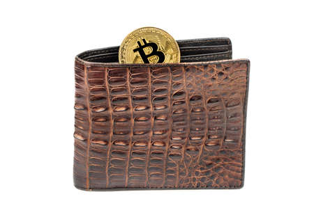 Gold bitcoin coin with leather wallet on white backgroundの写真素材