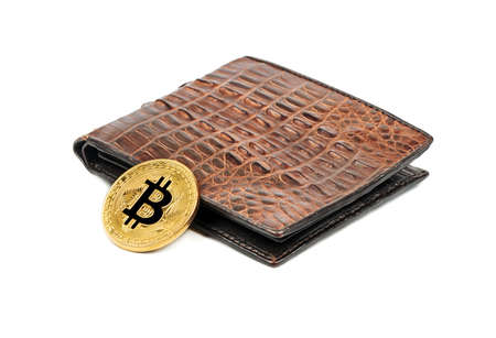 Gold bitcoin coin with leather wallet on white backgroundの写真素材
