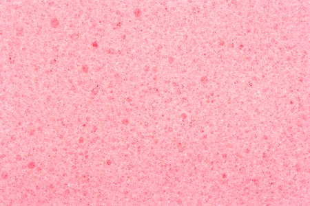 Background of pink sponge for washing dishes, close-upの写真素材