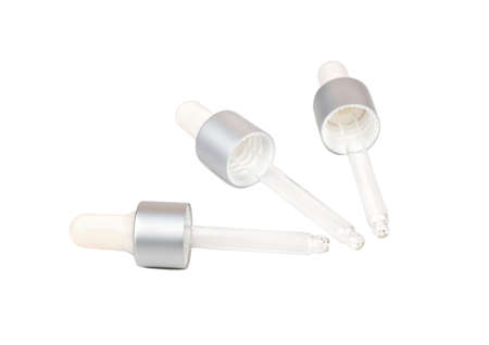Three medical glass pipettes on white backgroundの写真素材