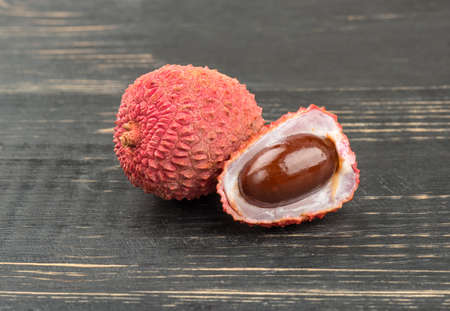 Lychee fruit on wooden backgroundの写真素材