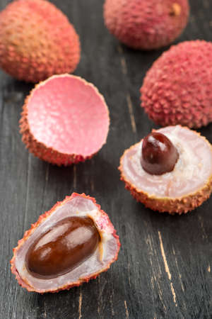Lychee fruit on wooden backgroundの写真素材