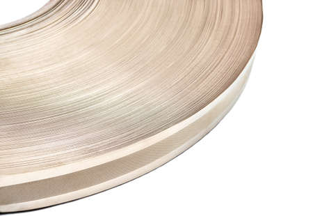 Part of round coil metal tape on white background close-upの写真素材